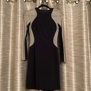 Long sleeve black and beaded dress.